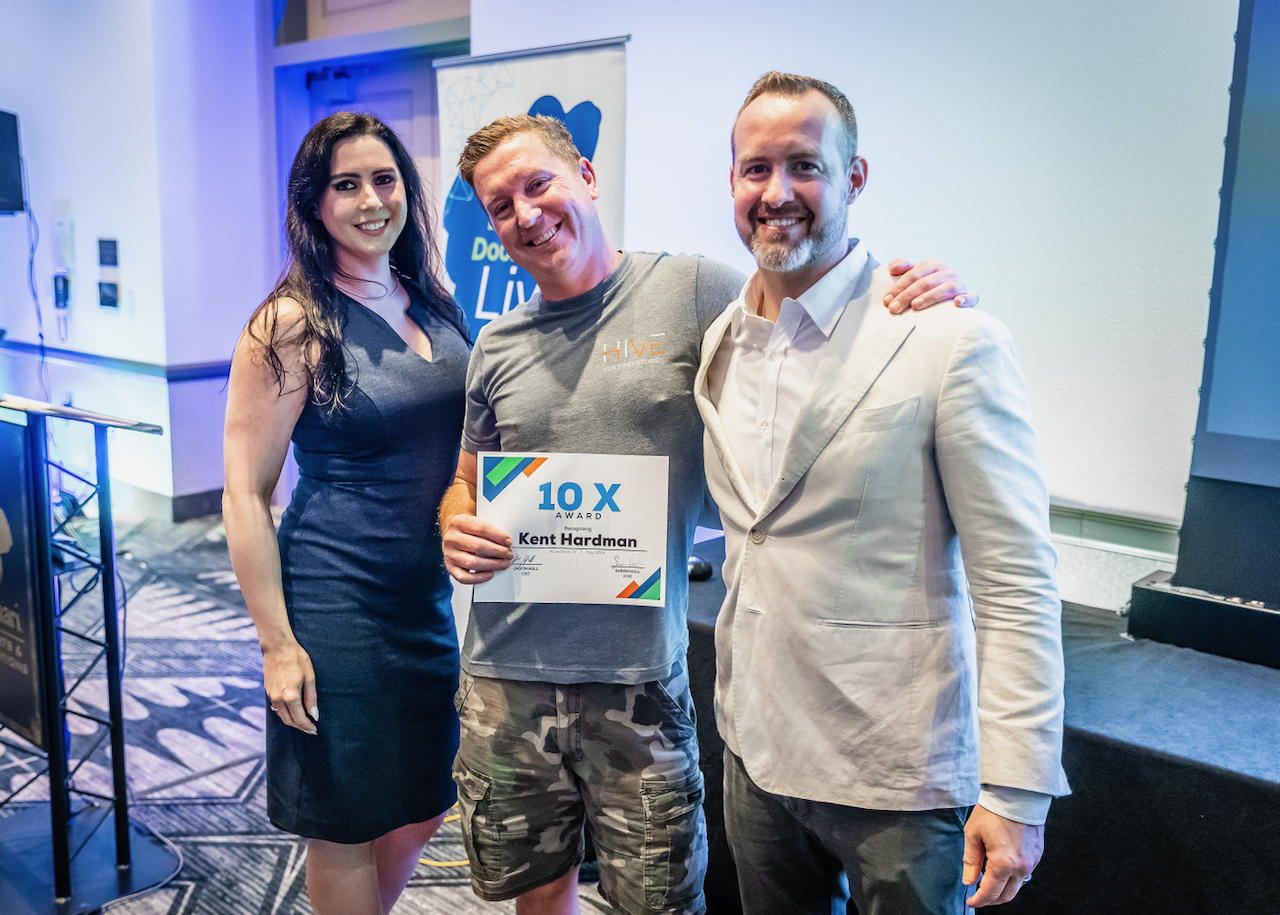 Kent Hardman receiving a DoorGrow 10X award